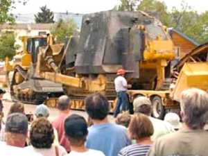 Men as they were attempting to crack open the Killdozer's cement slab armour.